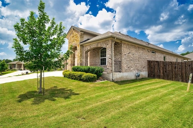View of home's exterior with brick siding, stone 