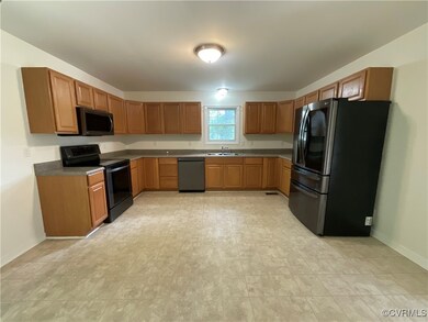 Kitchen featuring sink and black appliances