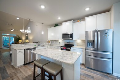 Kitchen featuring light hardwood / wood-style floo