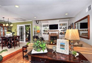 Living room with custom built-ins & recessed light