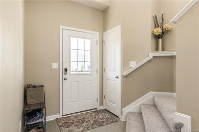 Nice front entry foyer with soaring ceiling!