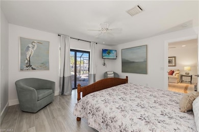 Bedroom with ceiling fan, access to outside, and l