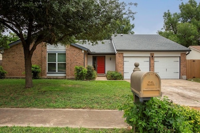 View of front of property with a garage, concrete