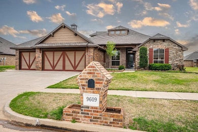 View of front facade with driveway, a front yard, 
