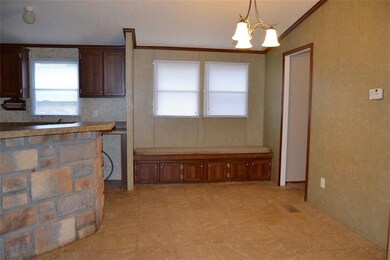 Dining area next to kitchen.