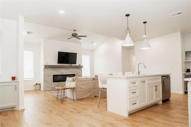 Kitchen featuring visible vents, dishwasher, a fir