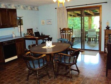 Kitchen. Kitchen has sliding glass door to rear de