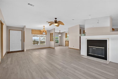 Living  Room looking back towards Entry Door, Dining Room & Kitchen Nook