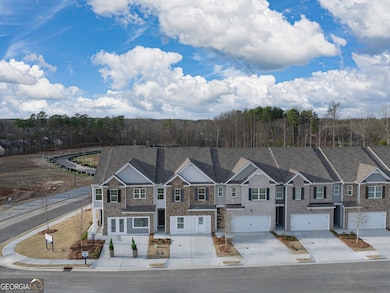 Sudbury front exterior of new construction townhomes at Greyton Springs in Buford, GA