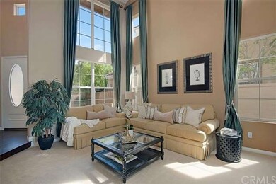 Dramatic two story high ceiling in the sun drenche