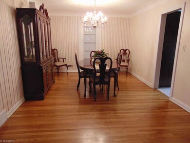 Spacious dining room with original hardwood floors
