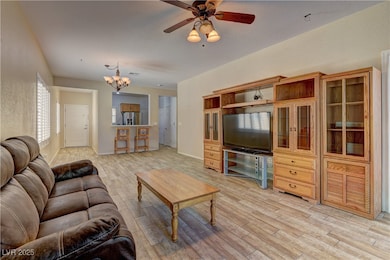 Living area with light wood-style floors, a ceilin