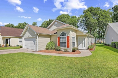 View of front of property featuring a garage, concrete driveway, a front lawn, and a shingled roof