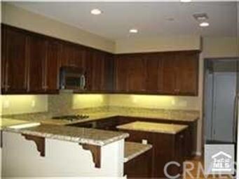 Spacious gourmet kitchen with granite counter tops