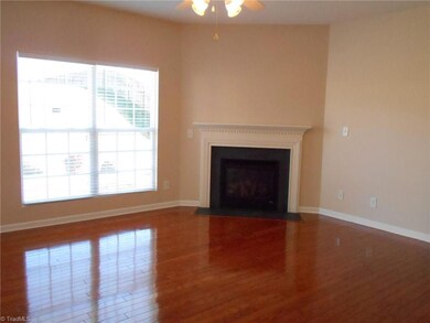 Living room has gas log fireplace & ceiling fan