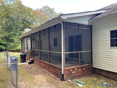 View of property exterior featuring a sunroom and crawl space
