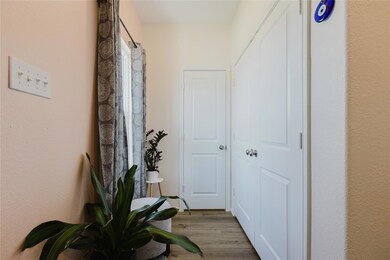 Hallway with wood finished floors