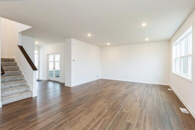 (Actual photo of the home) Spend time with friends and family in the spacious great room.