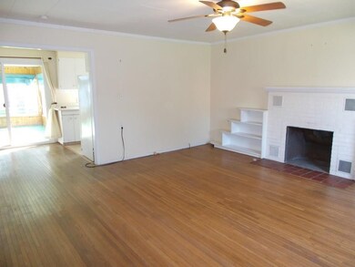 Livingroom opens to kitchen dining area. Hardwood 