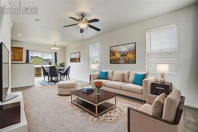 Virtually staged living room and dining area from entry