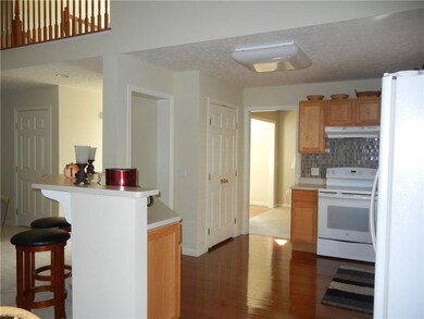 Kitchen with eating bar and Hardwood floors