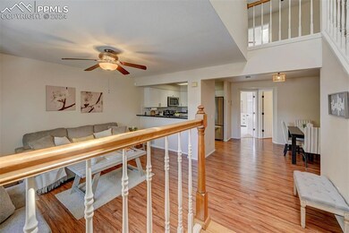 Walk in to a raised entryway, with gleaming wood f