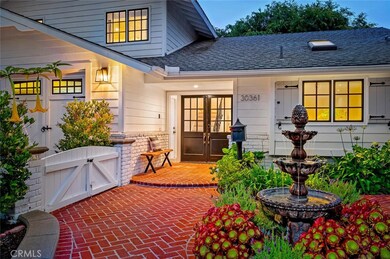 Inviting entry with fountain and brick work.