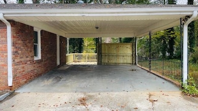 View of patio / terrace featuring an attached carport