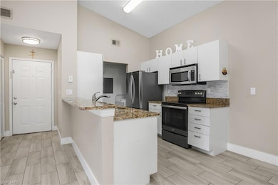 Kitchen with Granite Countertops & Stainless Steel Appliances