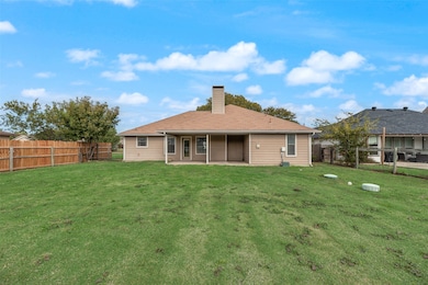 Spacious backyard located on one third of an acre lot.