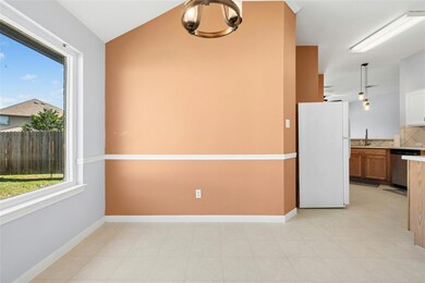 Spare room with a sink, baseboards, and lofted ce