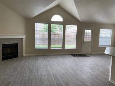 Inviting living room with vaulted ceilings, a cozy
