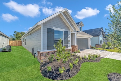 This single-story home has an inviting front porch