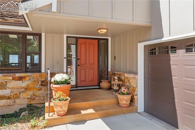 Freshly painted front door, newer exterior paint and insulated garage doors.
