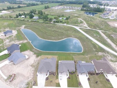 This beautiful home backs up to this pond.