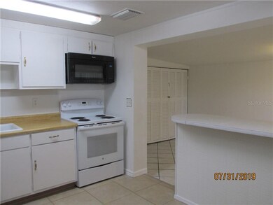 Space for bar stools separates kitchen from dining