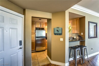 Kitchen featuring freestanding refrigerator, brown
