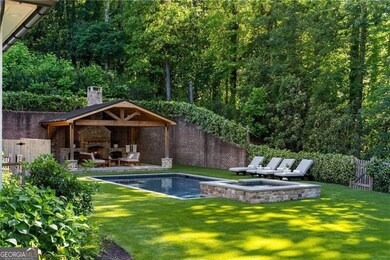 Saltwater pool, spa and cabana with wood burning fireplace.