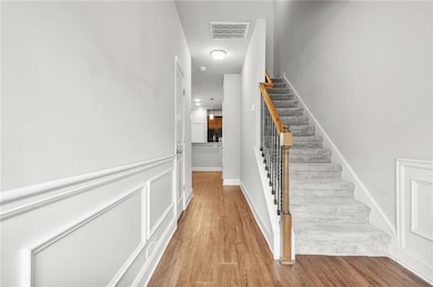 Stairway with wood finished floors