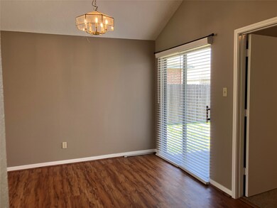 Bright dining area with sliding glass door to the