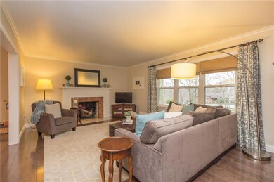Warm paint tones, rich hard wood floors and an inv