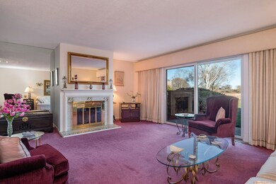 Spacious living room features glass doors to your 