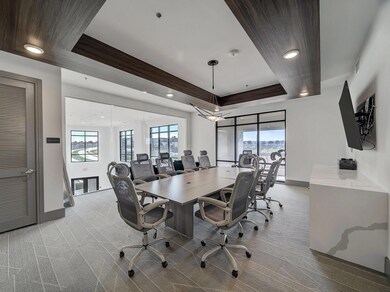 Carpeted office featuring plenty of natural light,