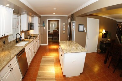 Another view of kitchen from den! Stainless dishwa
