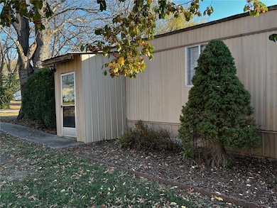 View of property exterior featuring an outbuilding