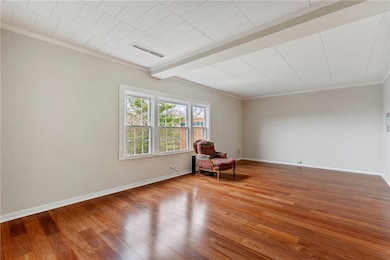 The gleaming engineered hardwood flooring througho