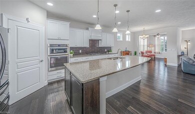 Take a seat at the massive kitchen island and you 