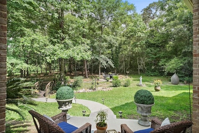 BACKYARD  Trees envelope the home in privacy.  WHO