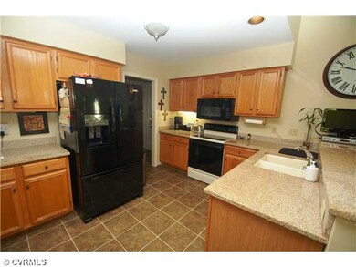 Kitchen - Updated eat-in kitchen with granite coun