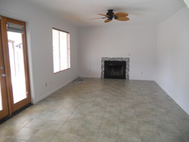 Family room with doors to pool area